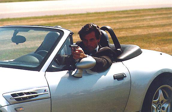 Brosnan's stunt double with gun in BMW